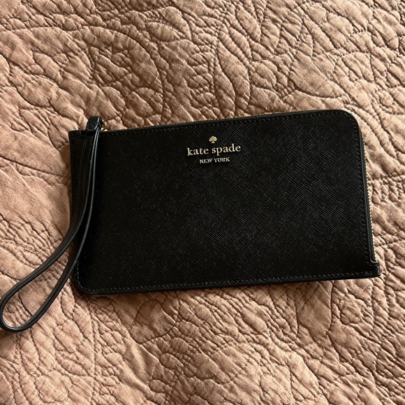 kate spade Handbags - kate spade black wristlet clutch with gold logo